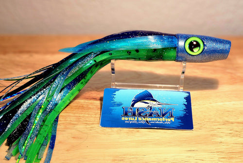 Colorful fishing lure with a Nash Performance Lures card on a wooden surface